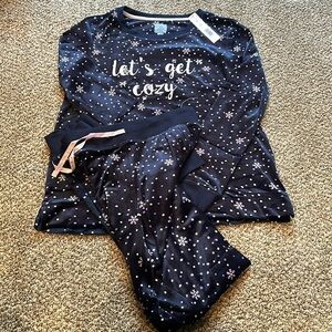 Navy blue plush pajamas either purple and white polka dots and pink snowflakes.